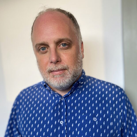 This is a headshot of John McEneny, Artistic Director for Piper Theatre Productions.